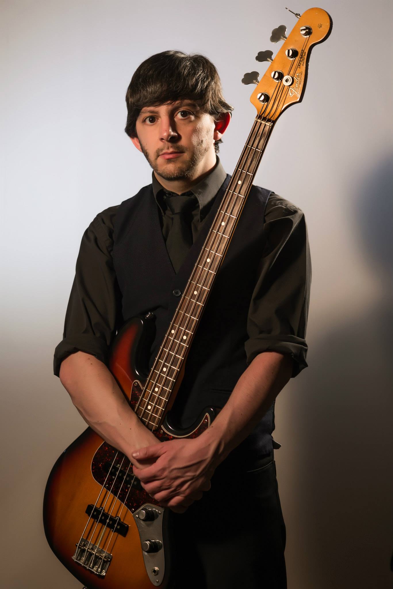 Steve Gisby holding an electric bass
